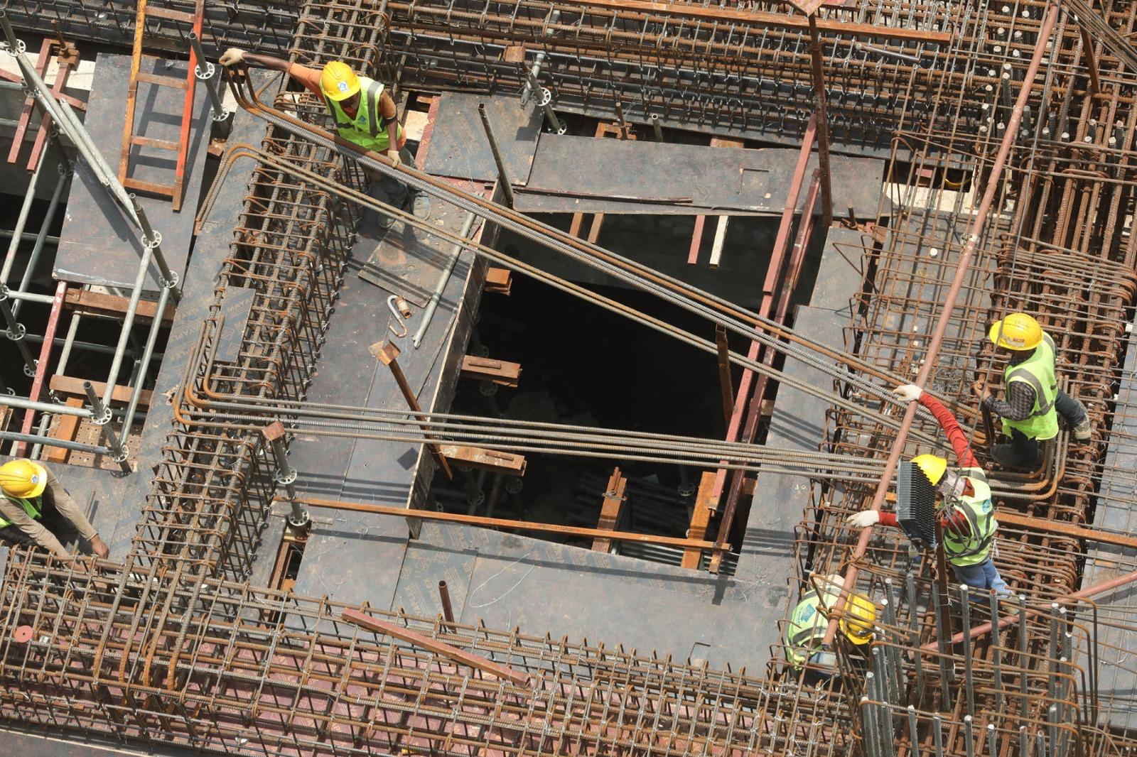 Workers diligently install cables and carry out construction at the Kamalapur Metro Rail landing station, advancing the project toward completion.(Photo: AH Sumon/V7N)